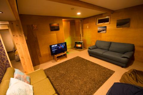 downstairs TV room with gas stove